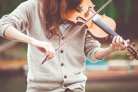 young woman playing a violin